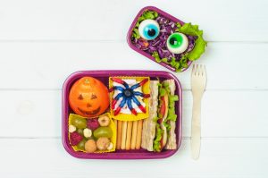 A view of a healthy Halloween-themed lunch for a child.