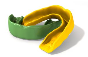 Close-up view of green and yellow mouthguards