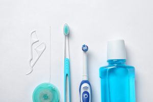 Oral hygiene products such as blue mouthwash, a toothbrush, an electric toothbrush, flossers and regular floss.